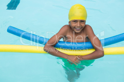 Smiling boy swimming in the pool