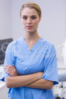 Portrait of dental assistant standing with arms crossed