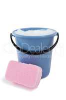 Close up of sponge by bucket containing soap sud