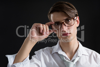 Androgynous man posing in spectacles