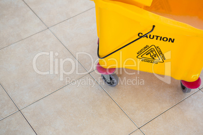 High angle view of sign on mop bucket
