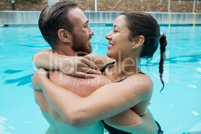 Couple embracing in swimming pool