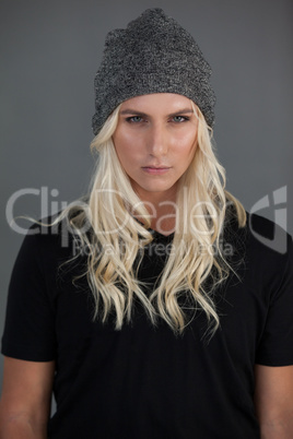Portrait of beautiful transgender woman wearing knit hat