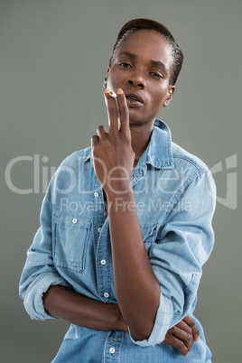 Androgynous man posing with cigarette