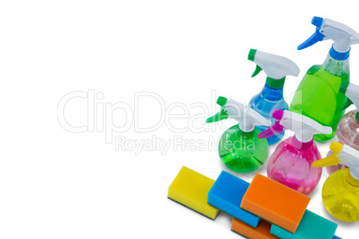 High angle view of spray bottles and cleaning sponge