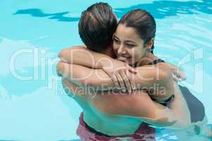 Couple embracing in swimming pool