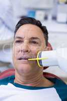 Male patient receiving dental treatment