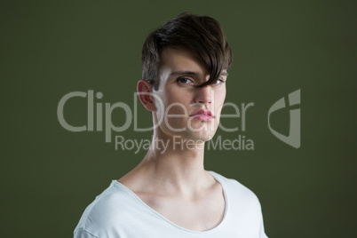 Androgynous man looking at camera