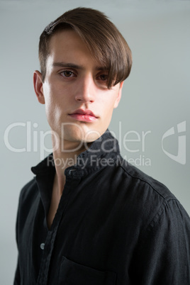 Androgynous man looking at camera