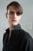 Androgynous man looking at camera