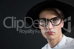 Androgynous man in spectacles