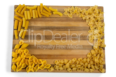 Various pasta on cutting board