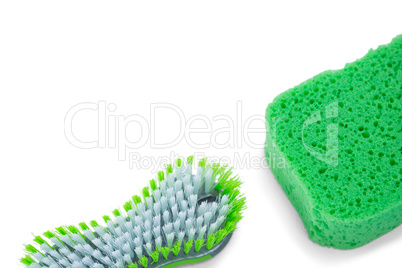 Close up of brush and green sponge