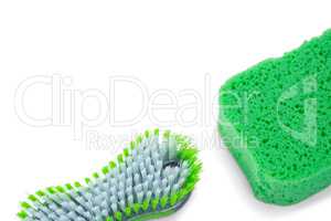 Close up of brush and green sponge