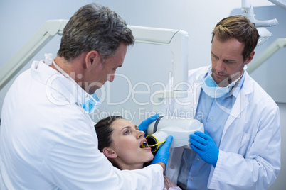 Dentists taking x-ray of patients teeth