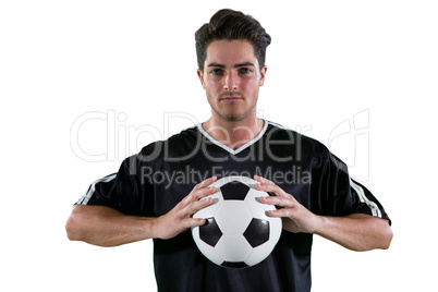 Football players holding football with both hands