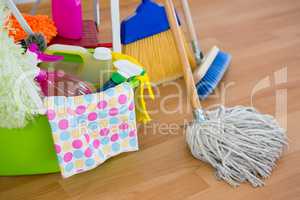 High angle view of cleaning equipment on hardwood floor