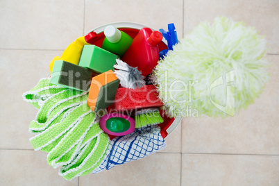 Overhead view of various cleaning products in bucket