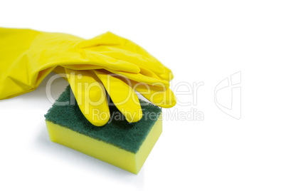High angle view of glove and sponge