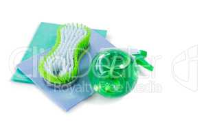 High angle view of brush and spray bottle with wipe pad