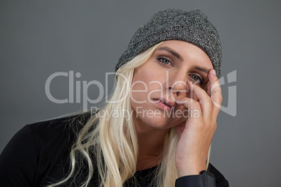 Portrait of transgender woman wearing knit hat