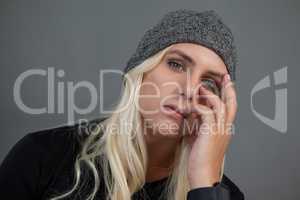 Portrait of transgender woman wearing knit hat