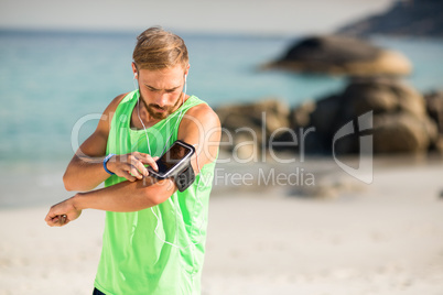 Man using phone at beach
