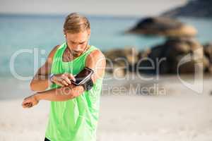 Man using phone at beach