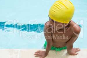 Boy standing in swimming pool