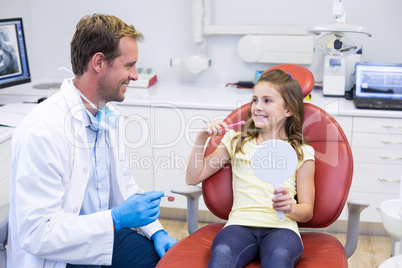 Young patient interacting with dentist in dental clinic