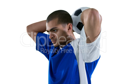 Football player about to throw the football