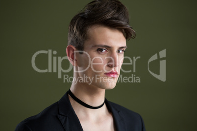 Androgynous man looking at camera