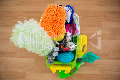High angle view of duster and cleaning equipment in bucket