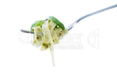 Spaghett rolled up in fork against white background