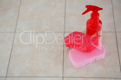 High angle view of cleaning sponge with spray bottle