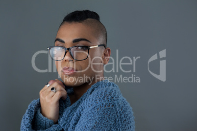 Portrait of transgender woman wearing eyeglasses