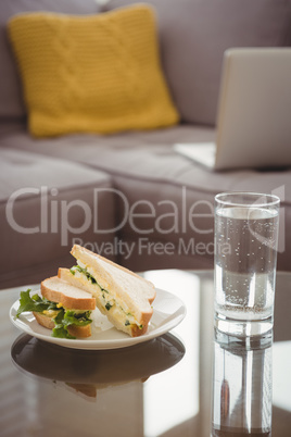 Close up of food in plate by drinking glass