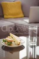 Close up of food in plate by drinking glass