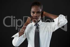 Androgynous man posing against grey background