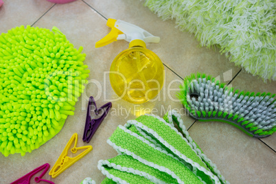 Overhead view of sponges and cleaning products on floor