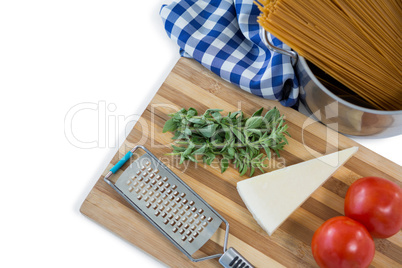 Food and grater on cutting board