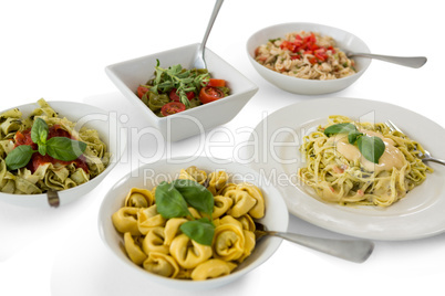 High angle view of various pasta served in containers