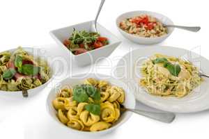 High angle view of various pasta served in containers