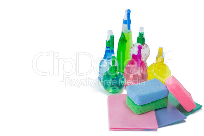 High angle view of colorful spray bottles with sponges and wipe pads