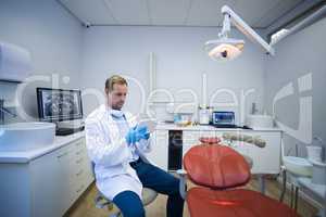 Doctor using digital tablet in dental clinic