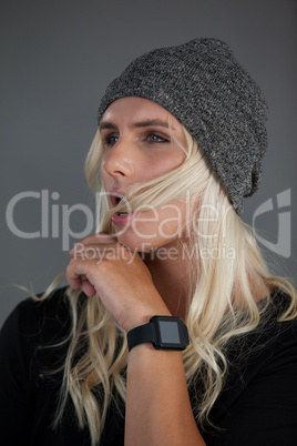 Transgender woman wearing knit hat