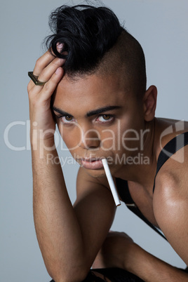 Portrait of transgender woman with cigarette