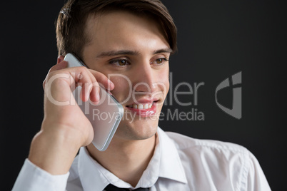 Androgynous man talking on his mobile phone