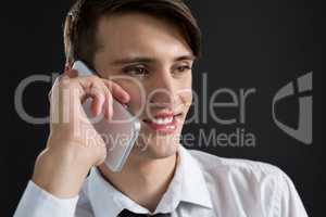 Androgynous man talking on his mobile phone