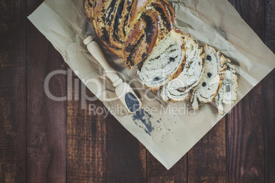 Baked pastry with poppy seeds on brown kraft paper